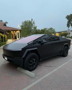 a futuristic car parked in a parking lot