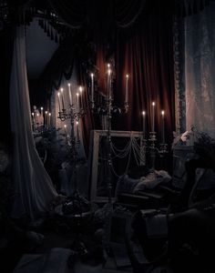 a room filled with lots of candles and furniture