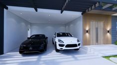 two black and white sports cars parked in front of a house with an open garage door