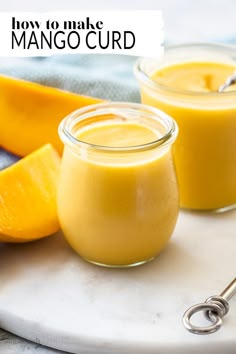 two glasses of mango curd on a white plate