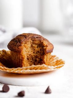 a muffin sitting on top of a white plate