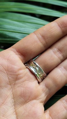 Silver And Gold Ring, Wedding Ring Band, Handcrafted Ring This handcrafted rustic ring band is simply beautiful! The wide textured Sterling Silver ring is inspired by Pre-Colombian jewellery; it is entirely handcrafted and is decorated with a yellow gold pattern. * Material: Hallmarked Sterling Silver & 18ct Solid Yellow Eco Gold * Dimensions: Approx 10mm (0.39in) Wide & 1.5mm (0.05in) thick * Ready to Ship in 10 business Days * Made in the United kingdom * Ring Size: Please select your Handmade Open Band Ring For Anniversary, Handmade Adjustable Wide Band Ring For Wedding, Hand Forged Open Ring For Promise, Handmade Heirloom Engraved Promise Ring, Handmade Open Couple Promise Rings, Unique Jewelry With Decorative Band As Gift, Unique Jewelry With Decorative Band For Gift, Unique Decorative Band Jewelry Gift, One Of A Kind Adjustable Wedding Ring