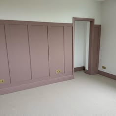 A neutral, textured carpet, paired with panelling and skirting boards painted in a muted, dusky pink tone. The image features traditional style radiators painted in a glossy white shade. Bedroom Inspirations Feature Wall, Bedroom Panneling Ideas Pink, Pink Panel Wall Bedroom, Dusty Pink Dressing Room, Master Bedrooms Decor High Ceiling, Pink Panelling And Wallpaper, Dusky Pink Walls, Sulking Room Pink Girls Bedroom, Pink Spare Room