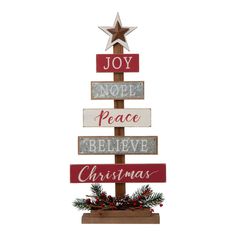 a wooden christmas tree with the words joy, peace, believe and christmas written on it