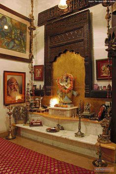 an ornate room with paintings on the wall and a fountain in the center, surrounded by candles