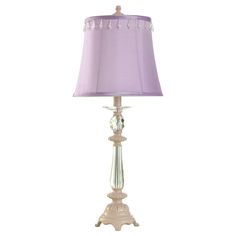 a table lamp with a purple shade on it