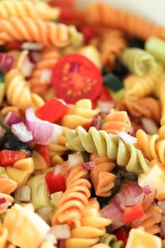 colorful pasta salad in a white bowl