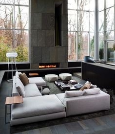 an instagramted photo of a living room with couches, tables and fireplace