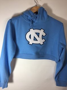 North Carolina Cropped Hoodie Casual Sports Hoodie Top, Cotton Sports Top With Hood, Fitted Casual Hoodie With Drawstring Hood, Casual Hooded Sweatshirt For Sports, Sportswear Top With Drawstring Hood For Fall, Fitted Crew Neck Hoodie For Spring, Sporty Sweats With Adjustable Hood For Fall, Sporty Double-lined Hood Sweats For Spring, Sporty Spring Sweats With Double-lined Hood