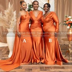 three women in orange dresses standing next to each other