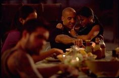 a group of people sitting around a dinner table