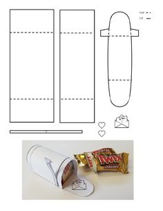 the paper roll is cut out and ready to be used as a candy wrapper