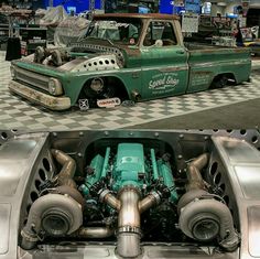 an old green truck with the engine in it's back end and another photo of its front end