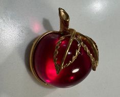 Wow!! I'm obsessed with Vintage brooches and this one does not disappoint!! Its Jelly Apple red Lucite body is in pristine condition!! Working pin - gold brass leaves and trim!! Just a whisper of the past - add to any Jean jacket for some Vintage Vibes! Collectible and addicting!! Set of 2 you get both!  Free Vintage matchbook with every order! Grandma Chic, Pink Apple, Apple Red, Gold Leaves, Eclectic Fashion, Sarah Coventry, Gold Brass, Coventry, Red Apple