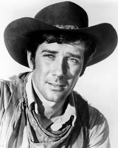 black and white photograph of a man wearing a cowboy hat