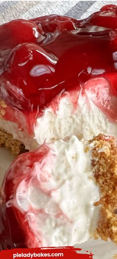 a piece of cheesecake covered in red and white icing