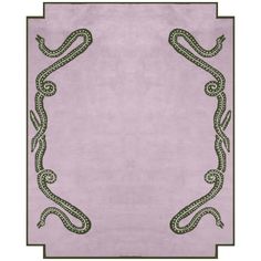 a pink rug with a snake on the front and green trimmings around it