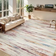 a living room filled with furniture and a large rug