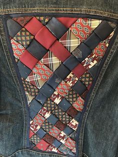 the back pocket of a jean jacket with ties in different colors and patterns on it