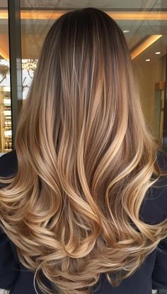 Check out 25 gorgeous must-try blonde hair colors for a stunning fall look. 🍁✨ #FallHairColors #BlondeHairTrends #AutumnBlonde #BlondeInspo #SeasonalHair #ChicBlondeStyles #WarmBlondeShades #HairColorIdeas #FallBeauty #BlondeTransformation Balayage Hair Tones Chart, Balayage Hair Brunette With Blonde Long Layers, Dark Roots To Blonde Balayage, Long Dark Blonde Hair With Highlights, Balayage Hair Light Brown To Blonde, Light Brown Hair Color Ideas Caramel, Blond Brown Balayage, Blonde Balayage Caramel, Caramel Honey Blonde Balayage