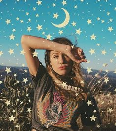 a woman with her hands on her head and stars in the sky