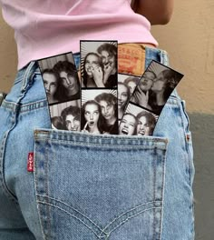 a woman's back pocket with pictures of people sticking out of her butts