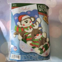 a package of design works christmas sock monkey