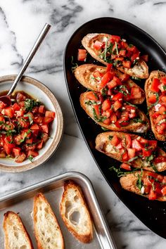 bread and tomato salad on a marble table