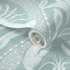 a blue and white wallpaper with an intricate design on it's side,