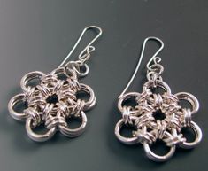 "Japanese Pattern Chain Maille Earrings Sterling Silver We begin by making the correct size individual Sterling Silver circles, then Mary Elizabeth creates the Chain Maille pattern - this one is a Japanese pattern. Beth then makes the Sterling Silver ear wires and additional elements for the final pieces. These are 2\" from the ear hole to the bottom, and the Chain Maille is 1\" in diameter. These are a wardrobe staple - perfect to wear almost anywhere with almost anything - they go from work to Silver Chain Link Earrings As Gift, Silver Chain Link Earrings For Gift, Metal Earrings With Hook And Links For Gifts, Chain Maille Patterns, Crafting Wire, Wire Jewelery, Hardware Jewelry, Handmade Chain, Chain Maille Jewelry