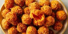 a bowl filled with fried food on top of a table