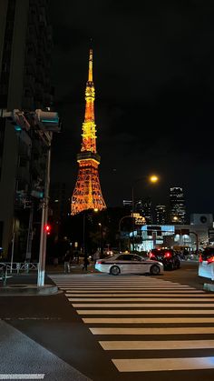 the eiffel tower is lit up at night in this cityscape photo