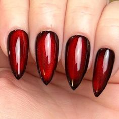 Pictured in medium stiletto and medium square.  Black Apres Gel X press-on nails with silver reflective cat eye topped with blood red jelly color gel. Looks completely black until the light hits just right, revealing a striking blood-red hue, almost appearing as if it's lit from within. Please note: colors and shine will vary depending on photography, lighting and angles. --MATERIALS AND CRAFTSMANSHIP-- This set is crafted with meticulous care using high-quality UV gel materials, including Après Red And Black Magnetic Nails, Blood Red Cat Eye Nails, Red Reflective Nails, Red Black Chrome Nails, Red And Black Cat Eye Nails, Red And Black Chrome Nails, Moulin Rouge Nails, Red Moon Nails, Black And Red Cat Eye Nails