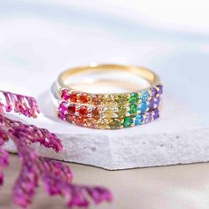 ---------------------------------------------------- Rainbow Eternity Band THE PRODUCT - Weather you're buying this for your love of rainbows, multiple gemstone properties, to show your support of the LGTBQ+ community, or celebrate your pet who have crossed the rainbow bridge, this is the most beautiful all natural gemstone rainbow ring you will ever find!  - This handmade eternity band is made with natural : ruby, garnet, citrine, lemon topaz, peridot, emerald, blue topaz, and amethyst. - We ha Adjustable Rainbow Gemstone Ring, Multicolor Half Eternity Rings As Gift, Rainbow Multi-stone Jewelry For Promise Ring, Rainbow Stackable Jewelry For Promise Ring, Rainbow Gemstone Jewelry Ring, Round Multicolor Jewelry For Promise, Multicolor Jewelry For Pride Gift, Pride Multicolor Jewelry Gift, Rainbow Gemstone Ring