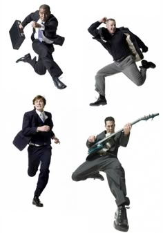 four men in suits are jumping and dancing