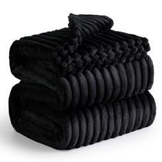 three black towels stacked on top of each other