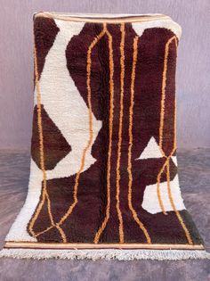 a brown and white rug with lines on it