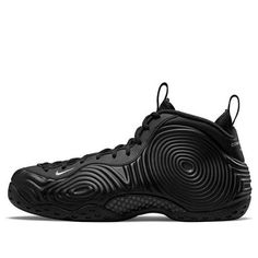 Introducing the Nike Air Foamposite One x Comme des Garçons Homme Plus. This collaboration brings you a sleek, monochrome take on the classic hoops shoe, originally released in 1997. The blacked-out synthetic upper is covered in wavy circular patterns, with branding elements including an embroidered mini-Swoosh and "Comme des Garçons Homme Plus" inscribed on the heel tab. The herringbone-traction rubber outsole features Penny Hardaway's 1 Cent logo. Professional yet casual, this sneaker is perfe Nike Foamposite, Comme Des Garcons Black, Retro Basketball Shoes, Runway Shoes, Foam Posites, Circular Pattern, Co Design, Nike Basketball, Best Sneakers