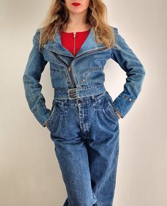 "A rare 1980s denim biker jacket by the English fashion designer Peter Golding, known for creating the first 'designer jean' in 1970, and whose clients included The Rolling Stones and David Bowie. The jacket is a classic biker style with a zip to one side, and fastening at the waist with a double button. There are decorative studs/rivets in two curves on the front of the jacket, round the cuffs of the sleeves and across the shoulders. The jacket features quite wide/exaggerated shoulders and a cr Retro Fitted Biker Jacket For Spring, Vintage Biker Jacket For Spring Streetwear, Vintage Recycled Denim Jeans For Fall, Vintage Long Sleeve Recycled Denim Jacket, Fitted Retro Denim Jacket, Spring Vintage Recycled Denim Jacket, Vintage Fitted Denim Jacket, Fitted Retro Denim Jacket For Streetwear, Fitted 90s Denim Jacket