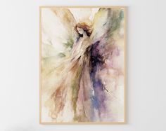 an angel painting hanging on the wall next to a chair