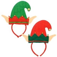 two red and green christmas hats on top of each other, one with an elf's hat