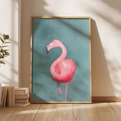 a pink flamingo standing on top of a wooden floor