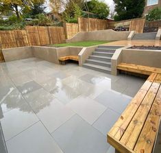 a wooden bench sitting on top of a cement patio