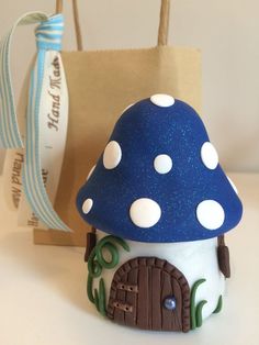 a toothbrush holder made to look like a mushroom house