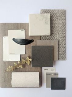 the interior design and decorating materials are arranged on top of each other, including paint swatches