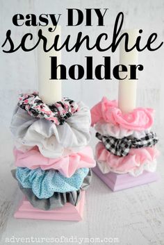 two candles are sitting on top of each other with the words easy diy scrunchie holder