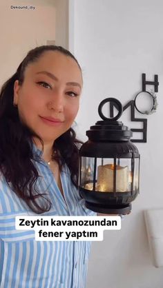 a woman holding a lantern in front of her face with the caption, zettin kavanoznandan fener yaptum