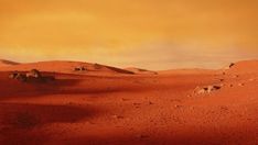 an orange sky over the desert with rocks and dirt on it's sides is seen in this image