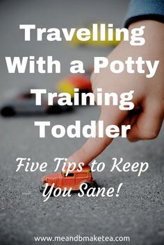 a child's hand reaching for a toy truck with the words traveling with a potty training todder five tips to keep you sane