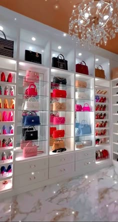 a room filled with lots of different types of purses